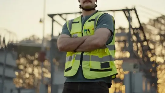 Square photo of person in vest